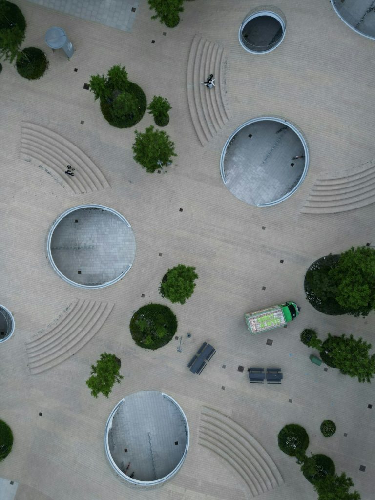 a group of people walking on a paved area 5gtyenqfz w